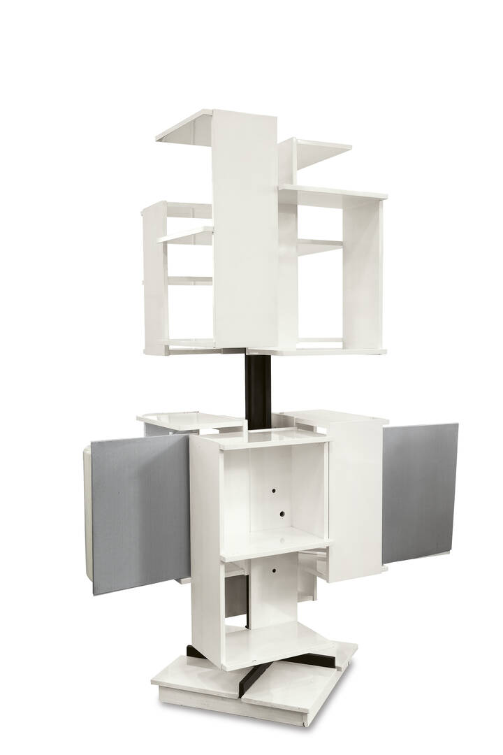 CLAUDIO SALOCCHI - Libreria da centro girevole in legno laccato e ante in acciaio satinato.