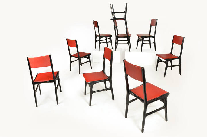 CARLO DE CARLI, attribuito - Nove sedie in legno ebanizzato e 