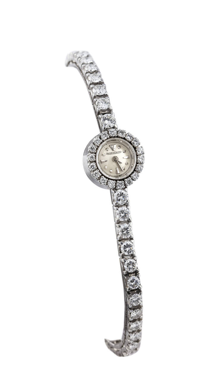 JAEGER LE COULTRE - Orologio gioiello, anni '50, in oro bianco montato su bracciale modello tennis con diamanti taglio brillante, 