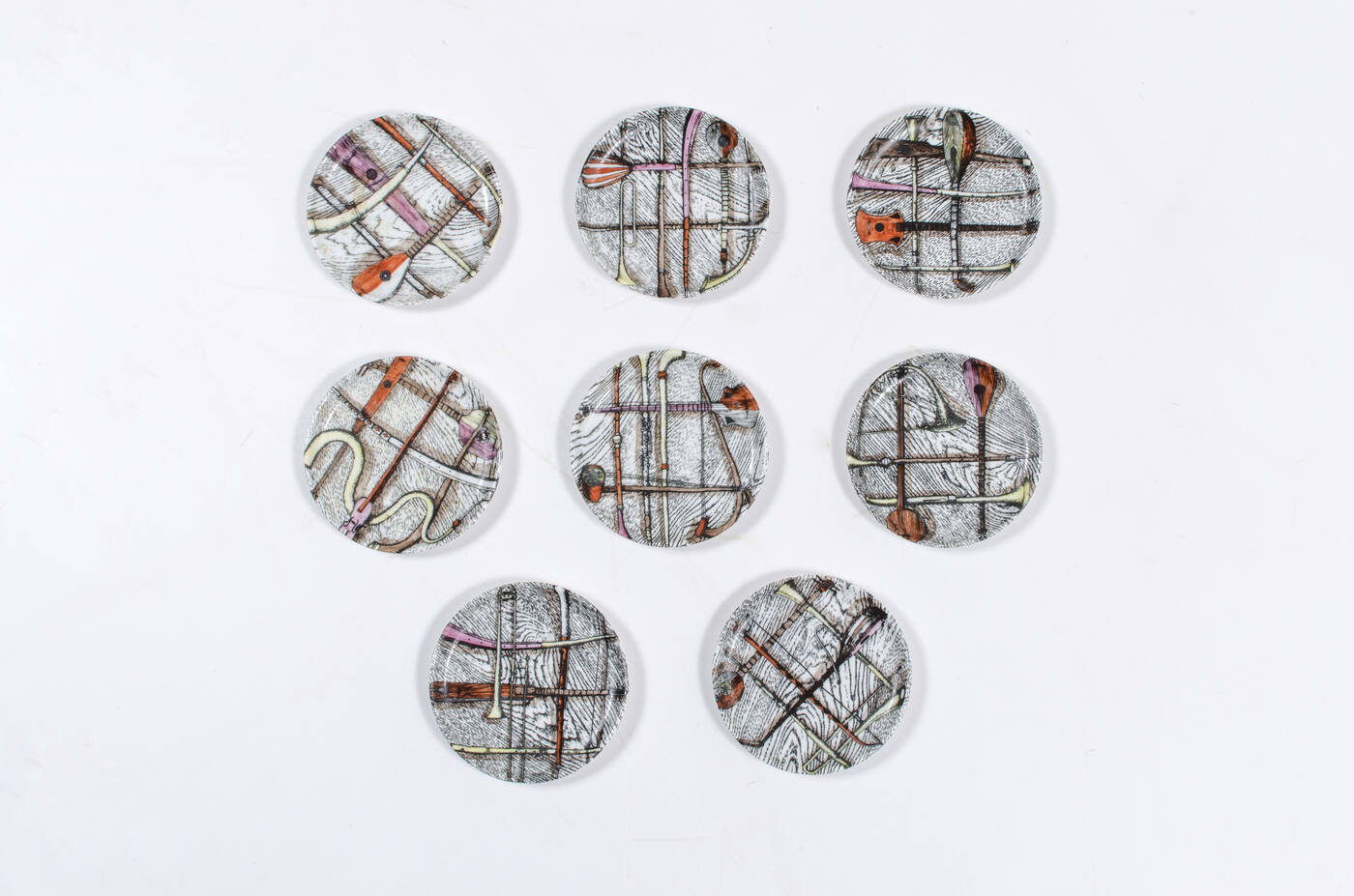 PIERO FORNASETTI - Otto piattini della serie 'Orchestra'