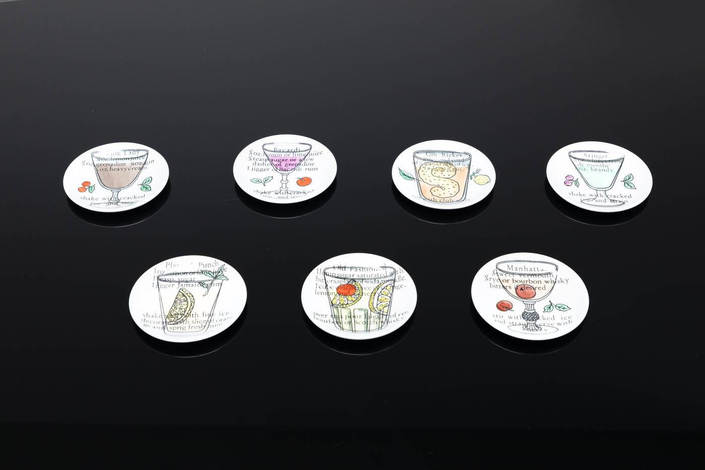 PIERO FORNASETTI - Sette sottobicchieri della serie Cocktail